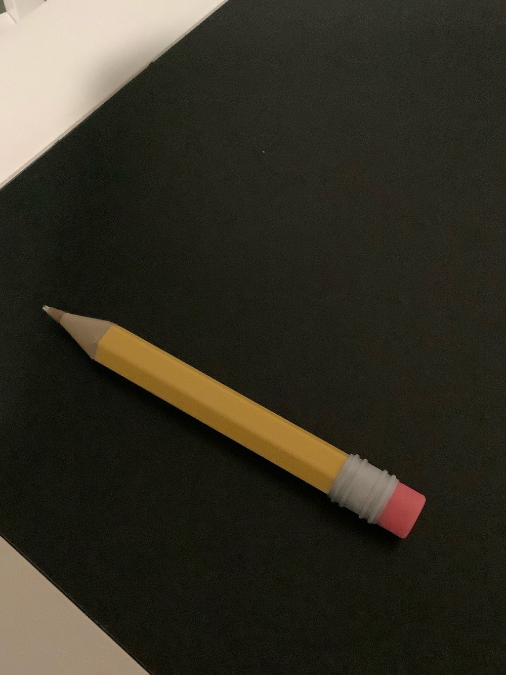 Pencil on black background